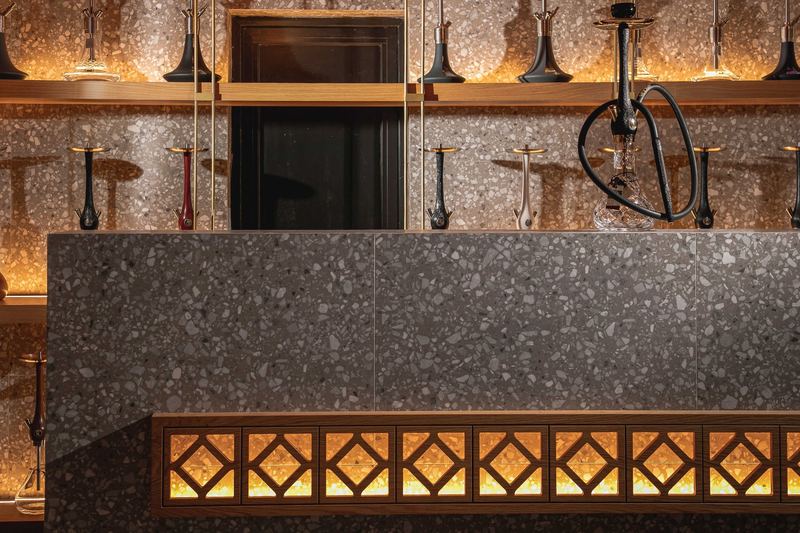 Backbar spirit shelves stocked with whiskey, gin and rum bottles at Al Hayat Rhodes
